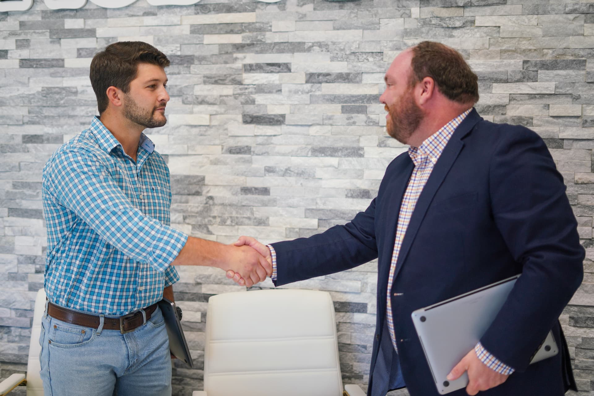 Waypoint Marketing team shaking hands with a client after a strategy session